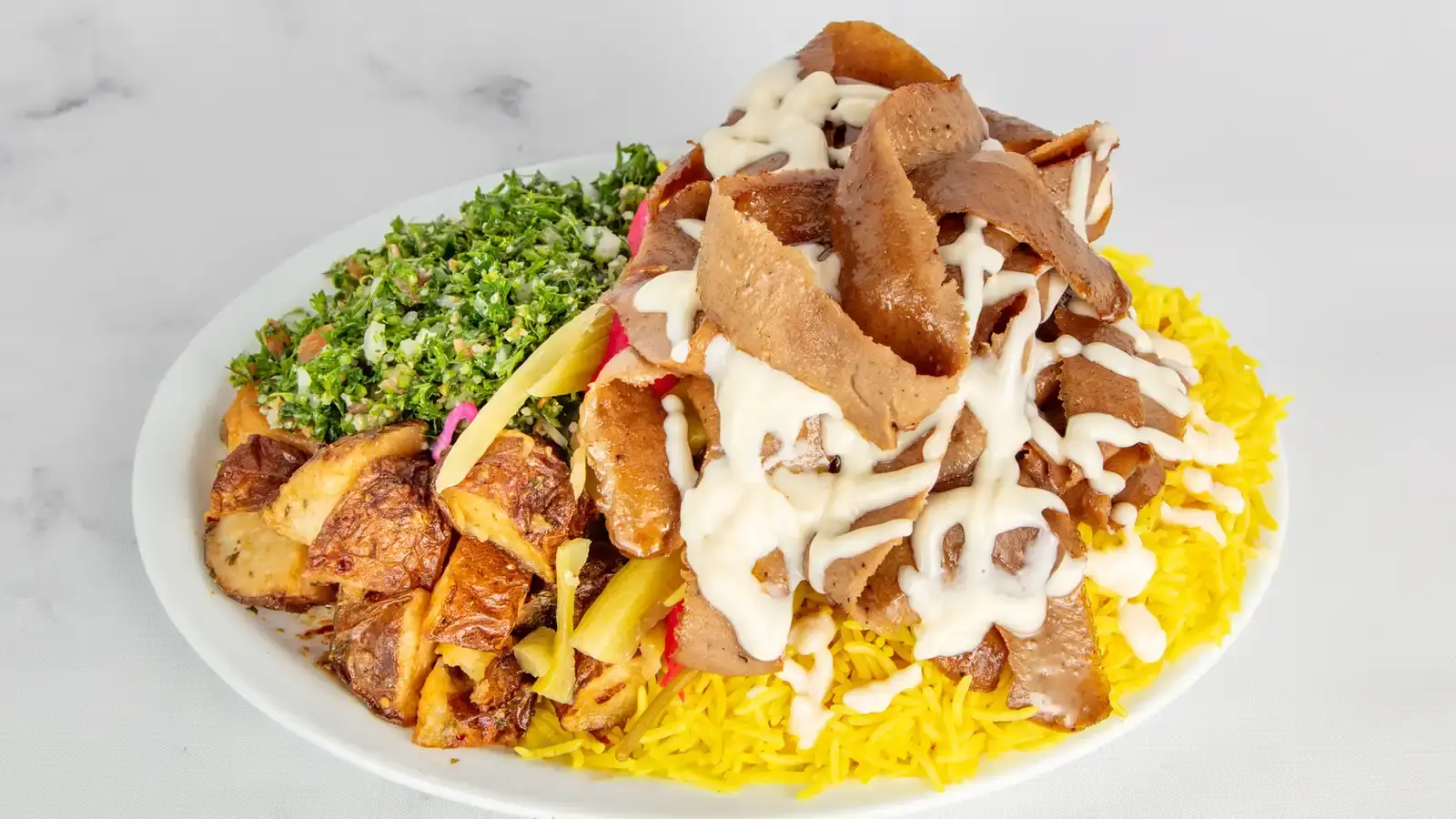 Chicken Shawarma Platter with yellow rice and tabbouleh at Donair & Shawarma House West Edmonton